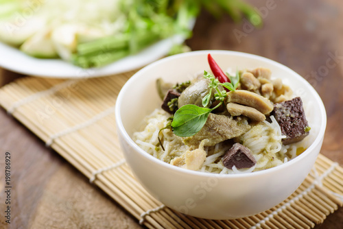 Thai food, rice noodles with green curry chicken (Kanom Jeen Kang Keaw Wan Gai)