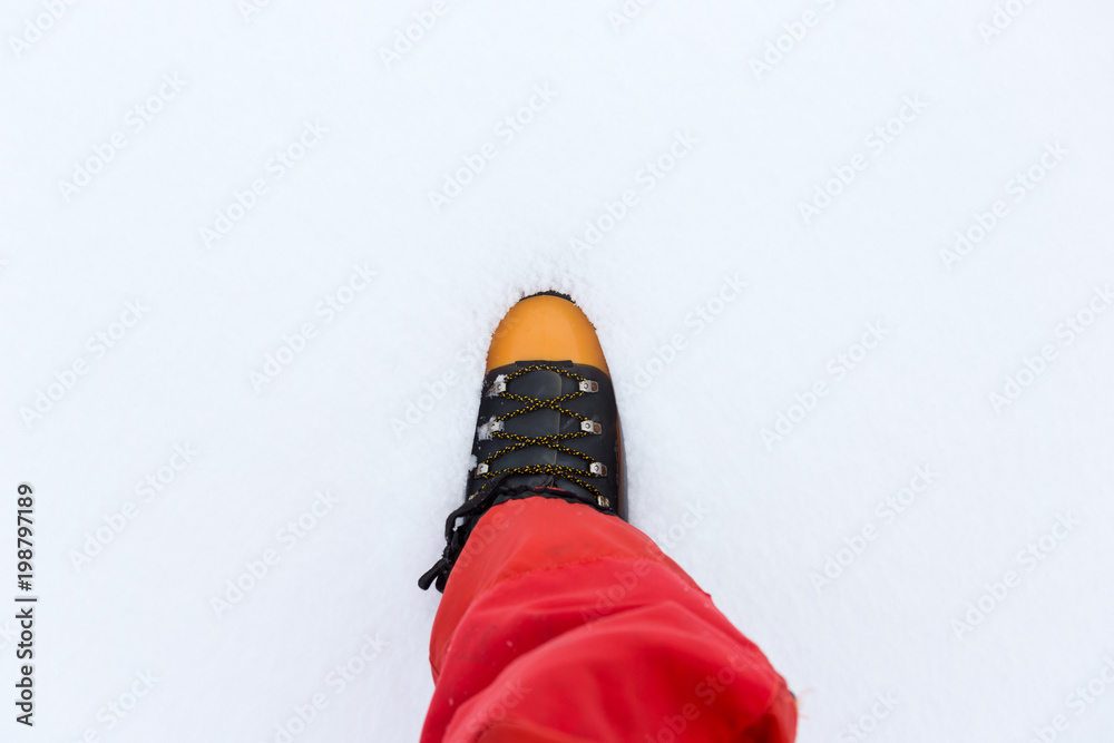 Boot buried in snow. Boot buried in snow.