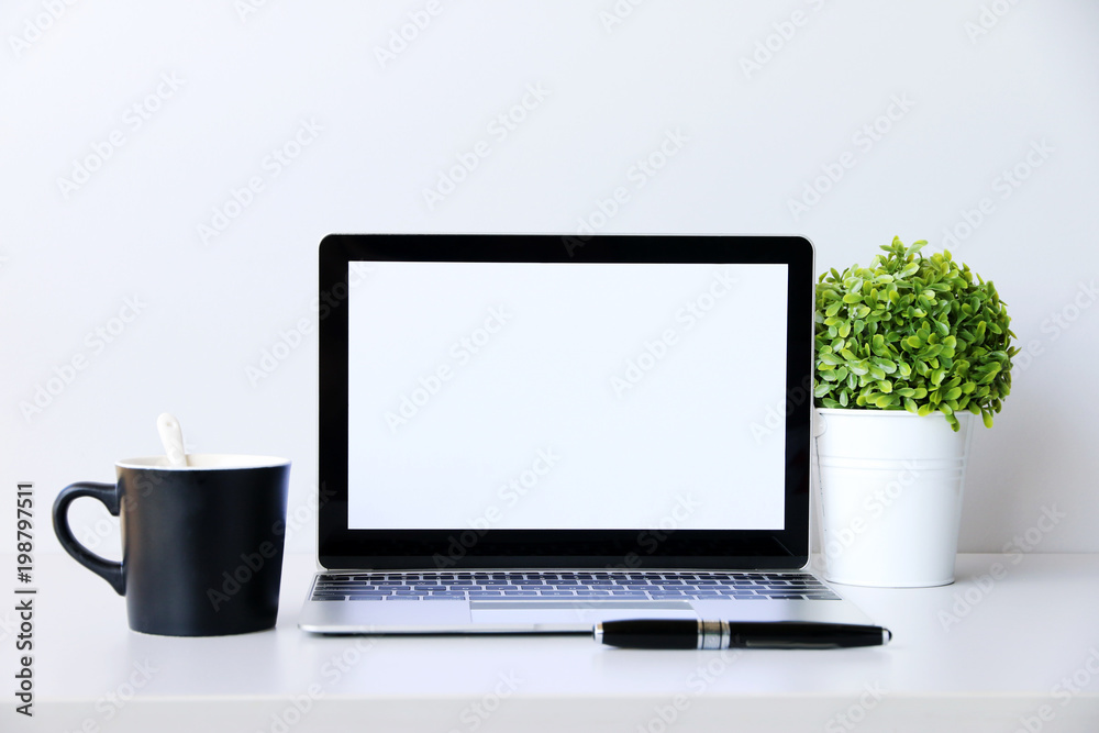 Working with Laptop computer,Hot coffee and plant copy space on desk background,business Concept Working with Laptop computer,Hot coffee and plant copy space on desk background,business Concept