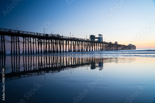 Bild auf Leinwand Pier Reflection at Sunset
