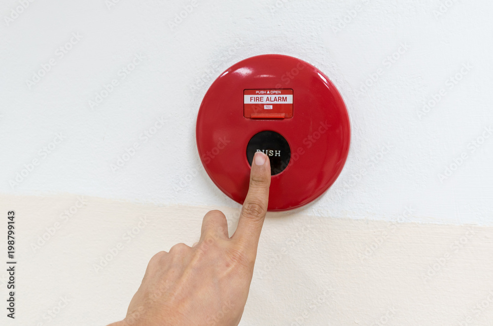 Fire alarm button in the building Photos | Adobe Stock