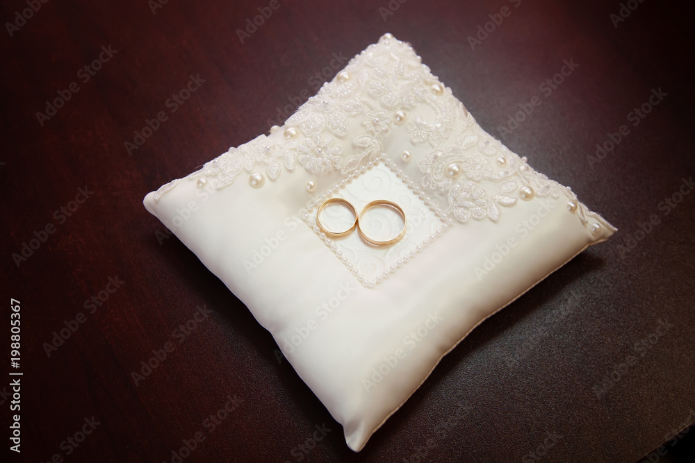 Engagement gold rings on the pillow Engagement gold rings on the pillow
