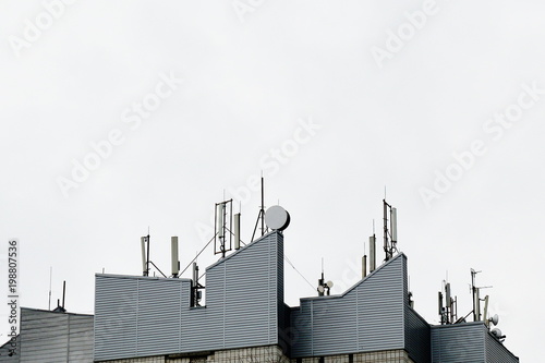 A lot of antenna to provide communication on the roof of the building.