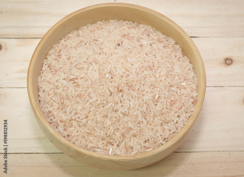 rice on the wooden background. rice on the wooden background.