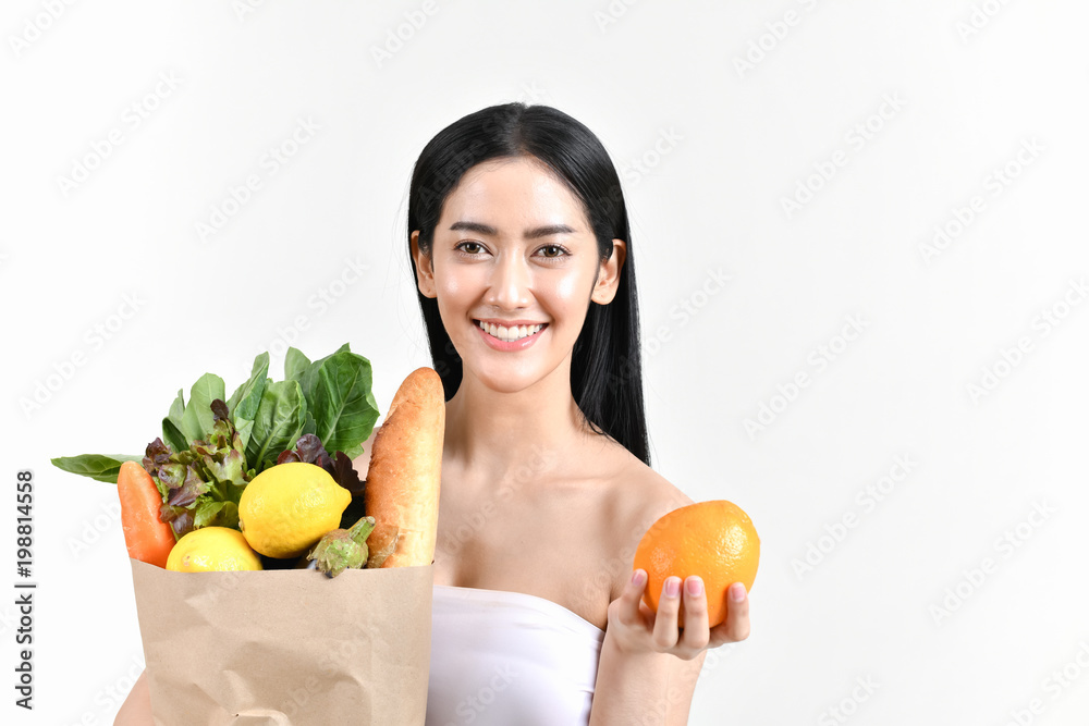 shopping concepts. Beautiful girls are buying fruits and vegetables. Beautiful girl to buy healthy food. Beautiful girl shopping at the bazaar. Asian girl suffocating bags of fruits and vegetables shopping concepts. Beautiful girls are buying fruits and vegetables. Beautiful girl to buy healthy food. Beautiful girl shopping at the bazaar. Asian girl suffocating bags of fruits and vegetables