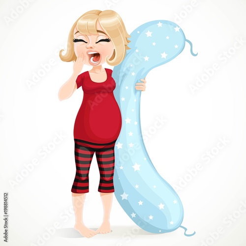 Beautiful sleepy pregnant blonde woman in pajamas with a long pillow for pregnant woman isolated on white background