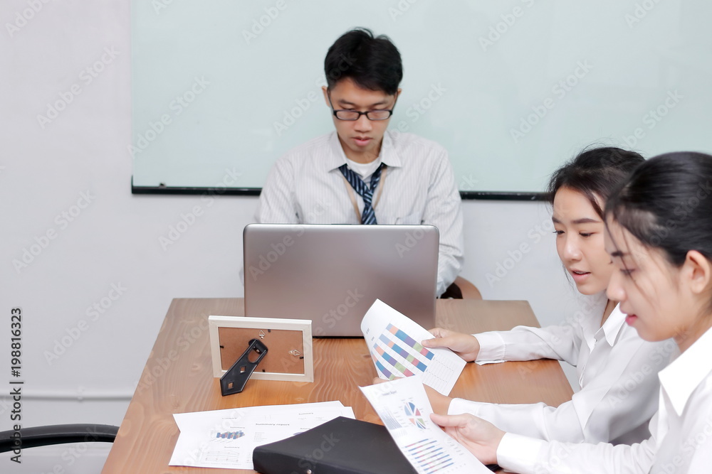 Group of Asian business people meeting in conference room. Selective focus and shallow depth of field. Group of Asian business people meeting in conference room. Selective focus and shallow depth of field.