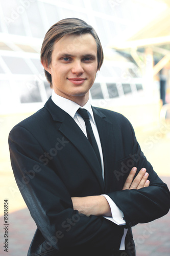 portrait of a young businessman on blurred background