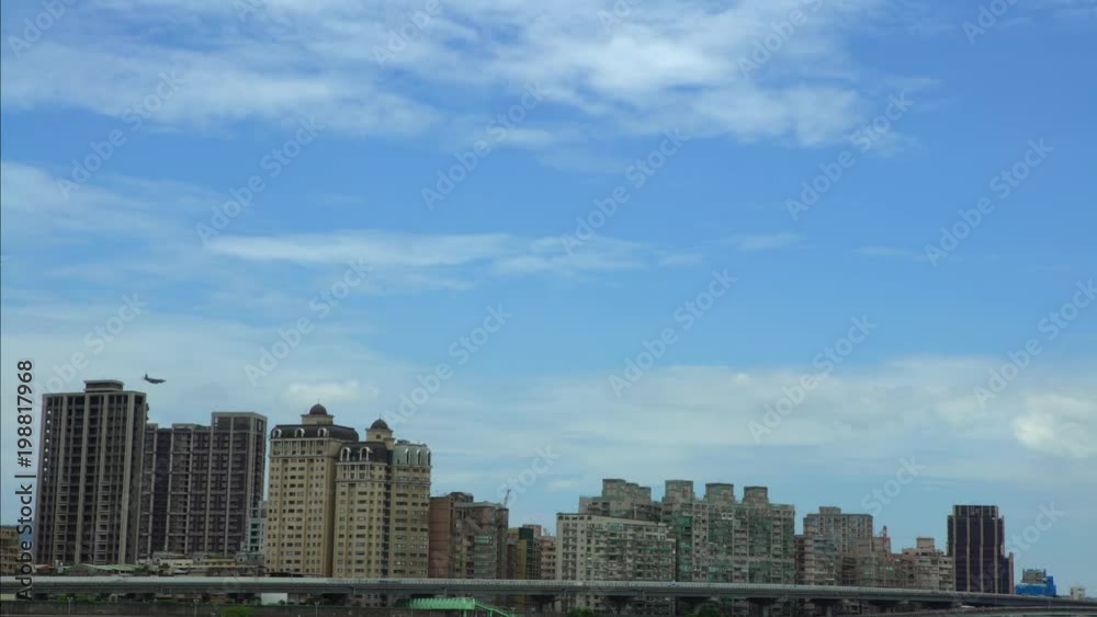 4k View of military plane flying low over the buildings in Taipei city. Airplane fly above skyscrapers. Plane in the air up houses an urban area in Taiwan. Flight trip with blue sky-Dan 4k View of military plane flying low over the buildings in Taipei city. Airplane fly above skyscrapers. Plane in the air up houses an urban area in Taiwan. Flight trip with blue sky-Dan