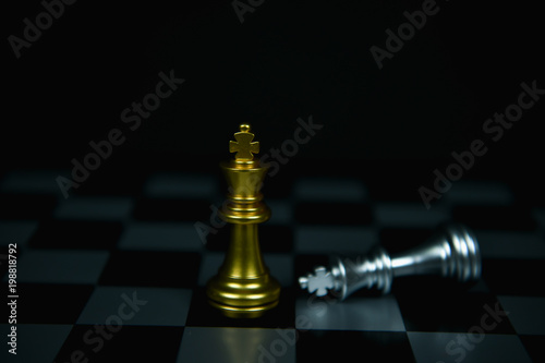 Leadership Concepts. Chess is a leader. Comparing chess is a strategic business plan. Businessman is playing chess. Chess game on a black background.