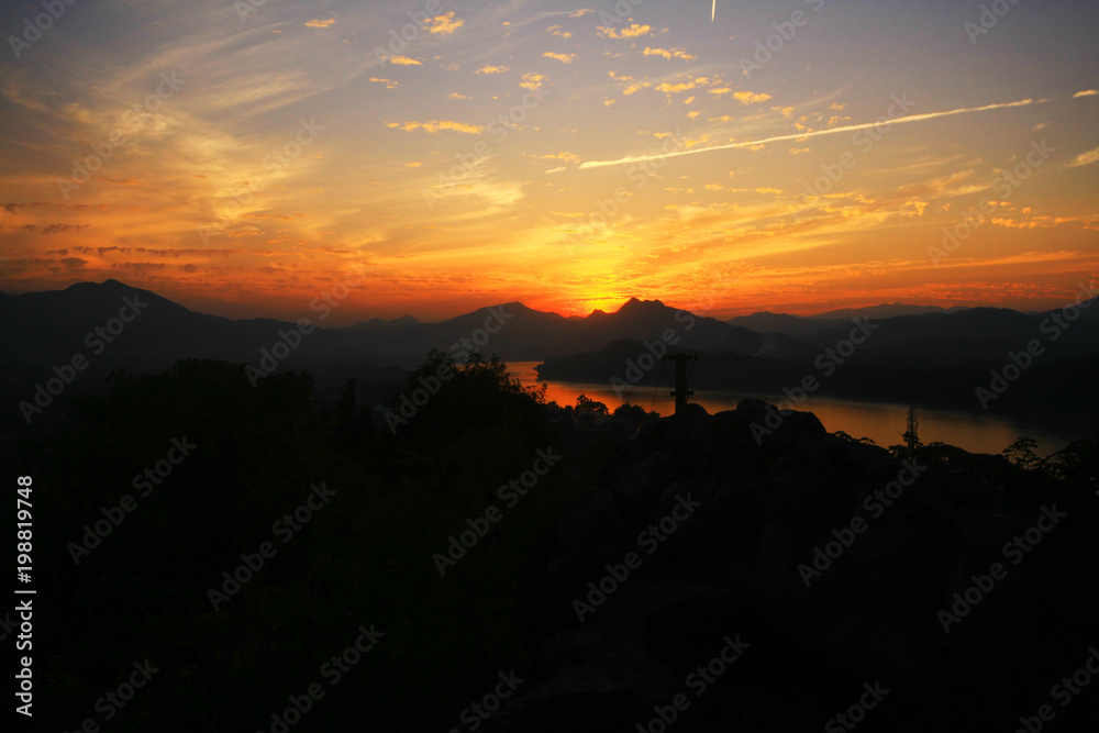 Silhouette mountain with river and sunset.Beautiful sunset and nature landscape