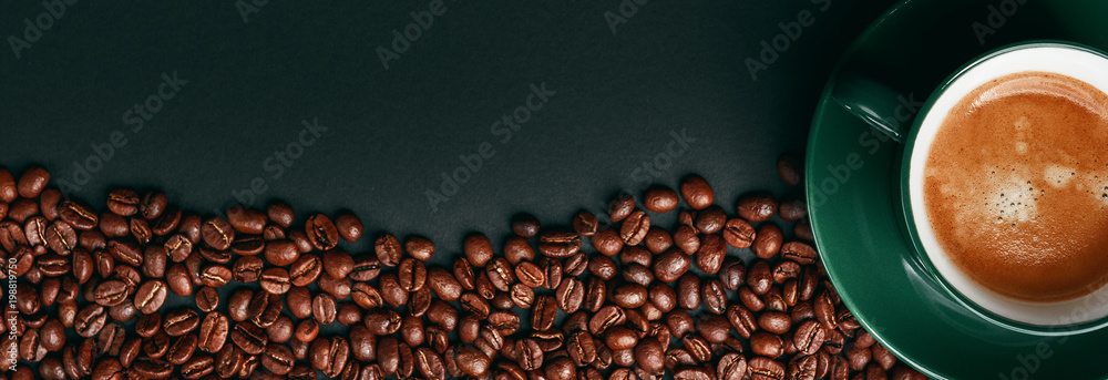 Naklejka premium strong black coffee in a mug of emerald color on a black matte background