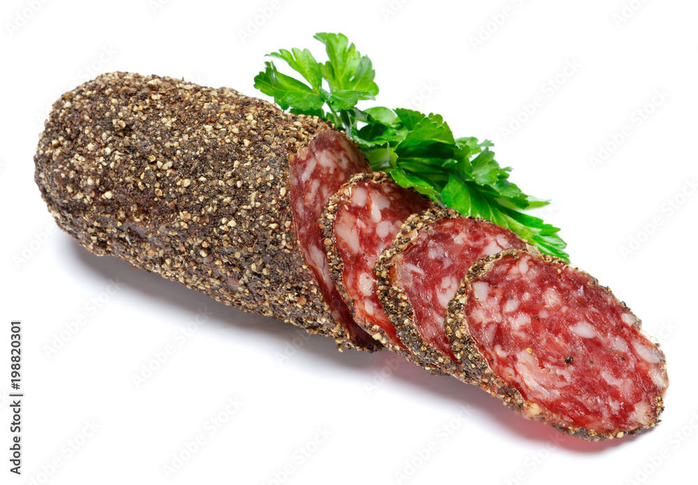 Dried organic salami sausage covered with pepper on white background