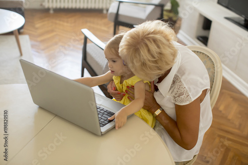 Little girl with grandmothe...