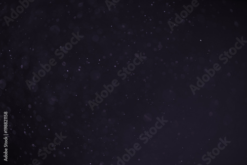 abstract dust particles over black background for overlay