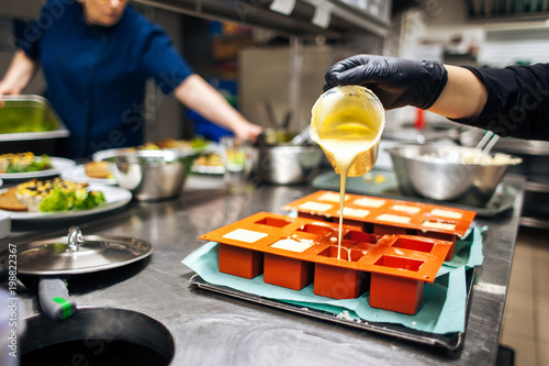 cook fills up desserts in the form