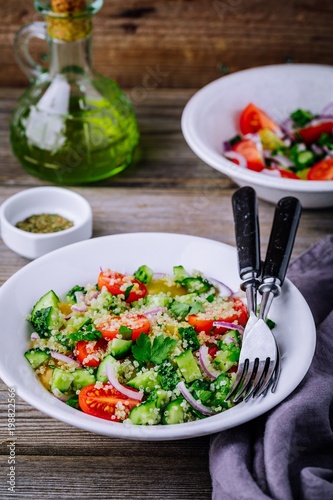 Quinoa Tabbouleh salad bowl with cucumbers, tomatoes, red onions and parsley