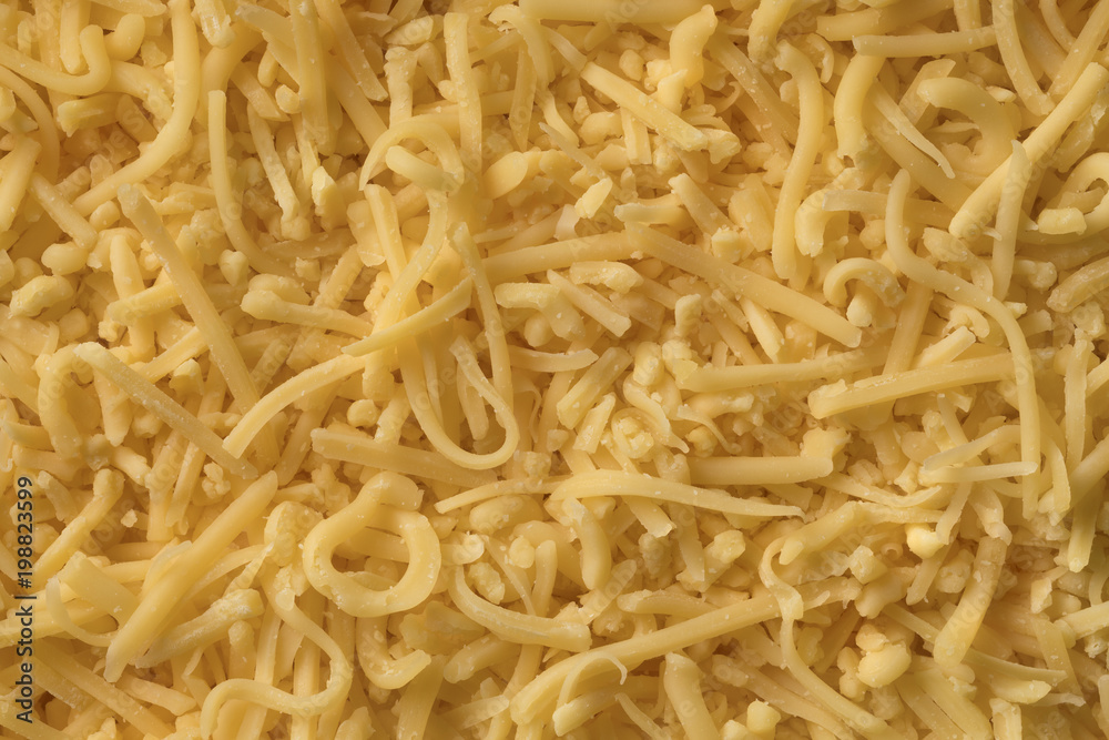 Grated Dutch Gouda cheese full frame Grated Dutch Gouda cheese full frame