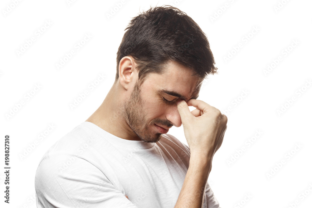 Negative emotion concept. Young man crying about his failure, feeling bad about unpleasant situation. Negative emotion concept. Young man crying about his failure, feeling bad about unpleasant situation.
