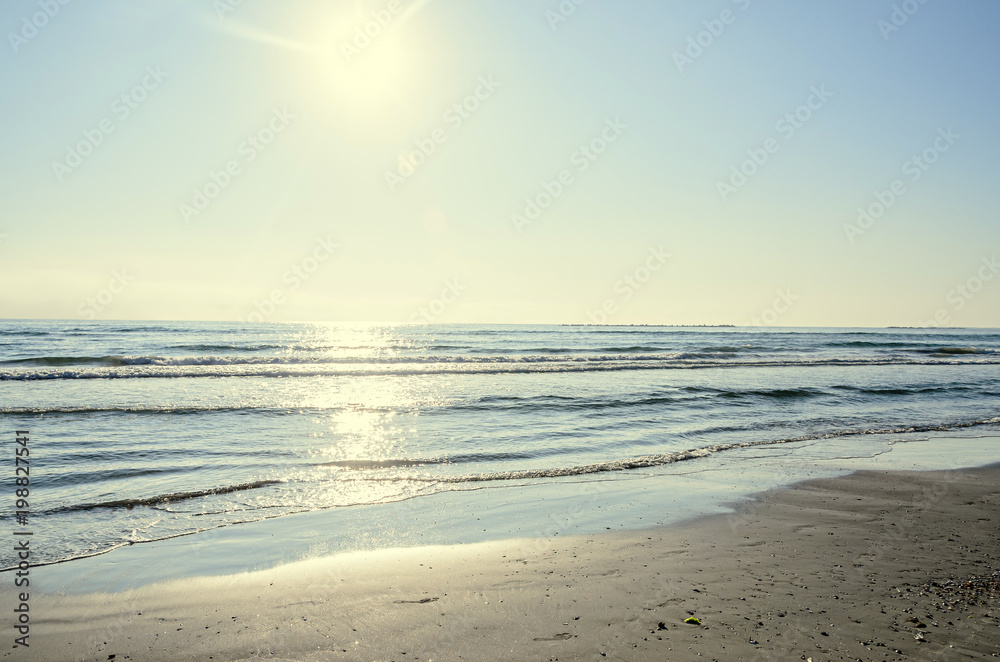 Beach of Black Sea from Mamaia, Romania with blue clear water and golden sand