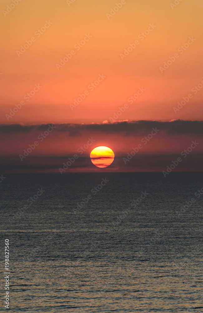 Beach of Black Sea from Mamaia, Romania with golden orange sky, sands and blue clear water, sunrise Beach of Black Sea from Mamaia, Romania with golden orange sky, sands and blue clear water, sunrise