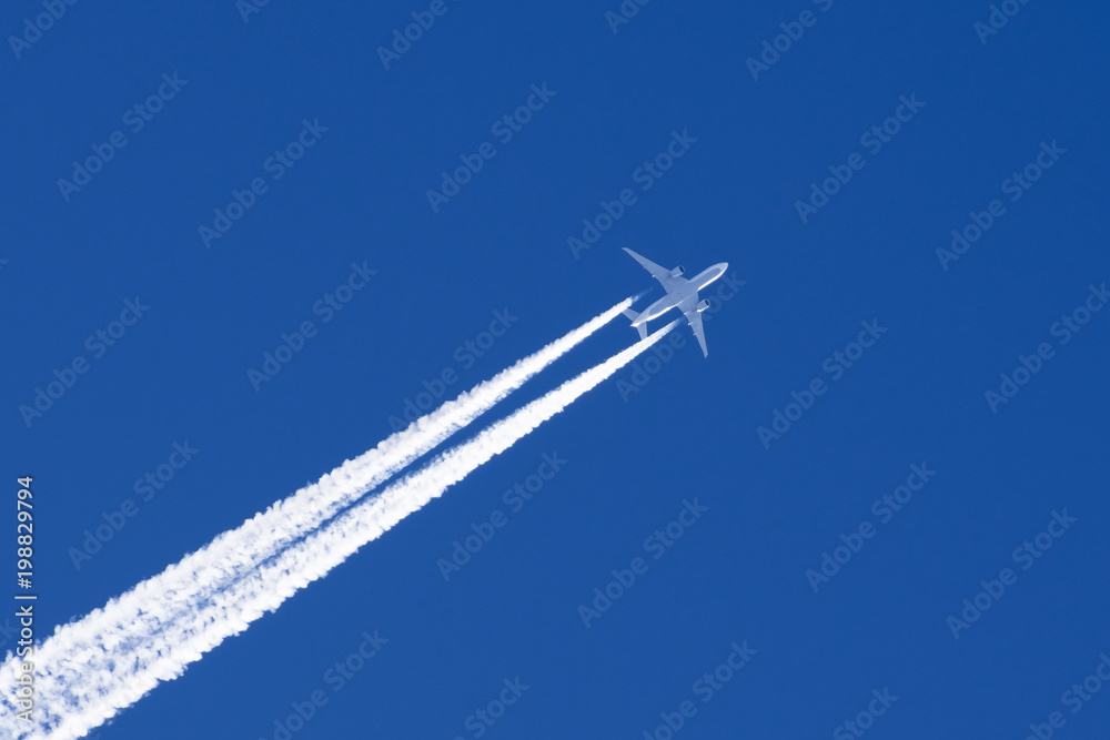 White big passenger airplane two engines aviation airport contrail clouds. White big passenger airplane two engines aviation airport contrail clouds.
