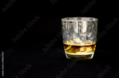 Whiskey glass isolated on black background