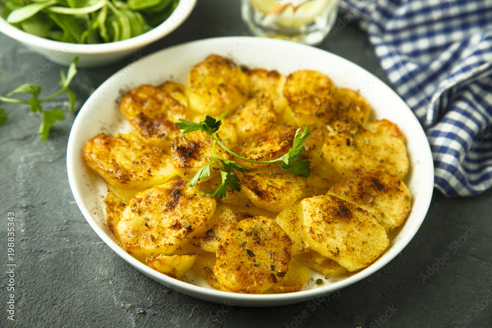 Homemade potato gratin with cheese and herbs Homemade potato gratin with cheese and herbs