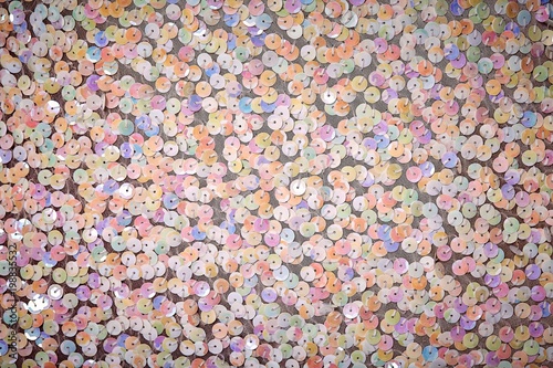 Background - texture festive designer fabric embroidered sequins, beads © Nikolay
