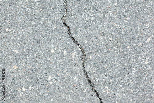 enlarged crack on a flat stony background