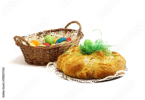 easter eggs in basket with yeast pastries bread plait