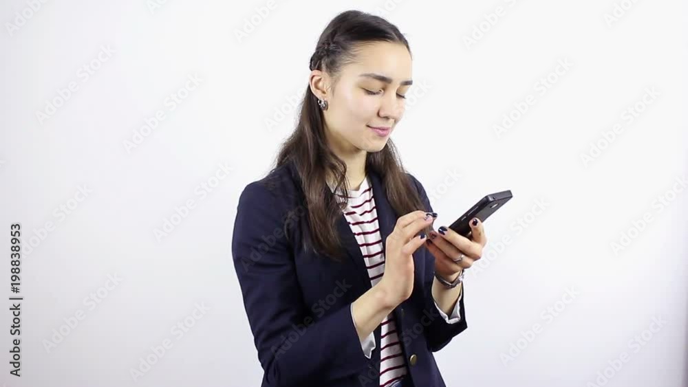 Young beautiful woman hand writing SMS, texting on smartphone. Young beautiful woman hand writing SMS, texting on smartphone.