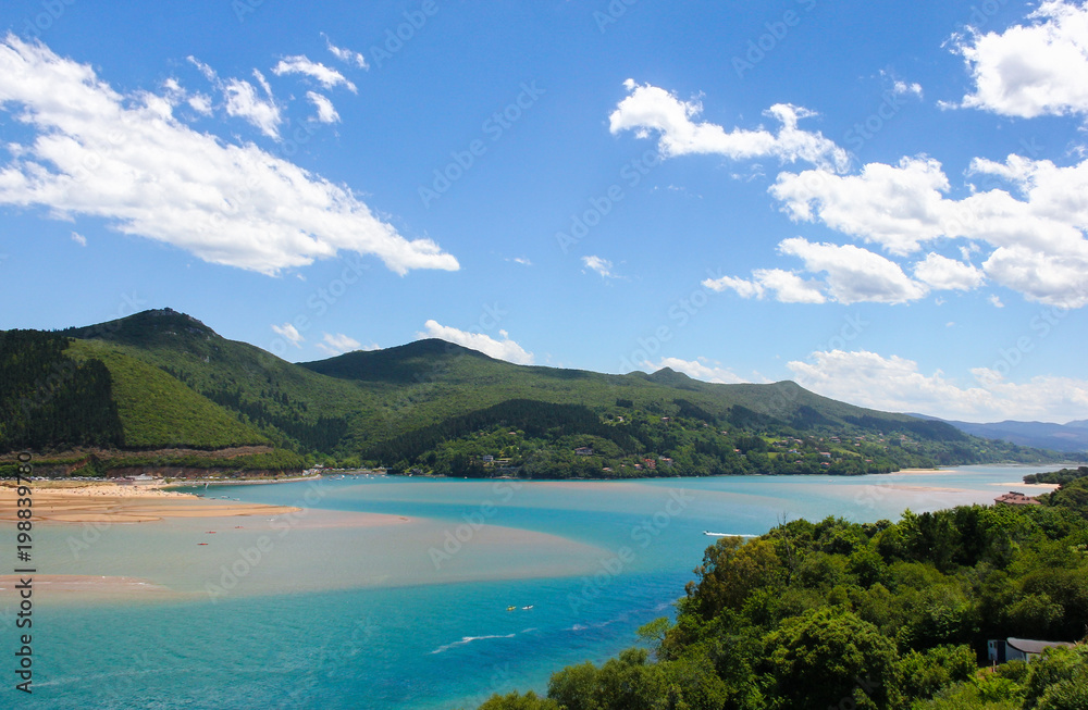 Splendid views of Urdaibai biosphere reserve with mountains, blue sky and white clouds on the background, in the Basque Country
