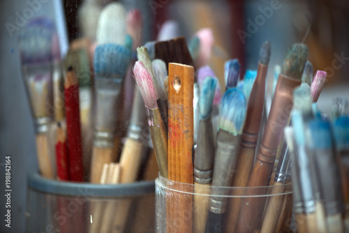 Different painting brushes in paiter's atelier. Close-up.