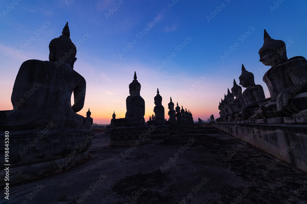 Big buddha statue in beautiful sunrise or sunset at  Nakhon si thammarat Province, Thailand.
