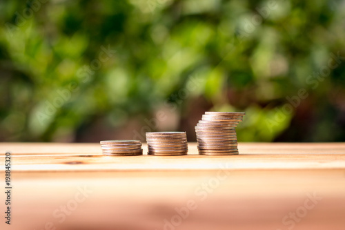 Coin placed on a wooden table with background blurry