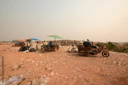 Workers separate waste for sale.Separate garbage collection. Recycling and storage of waste for further disposal. © kasira698