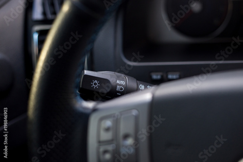 Close up of light switch in a car steering.
