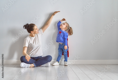 Mother is measuring growth of child