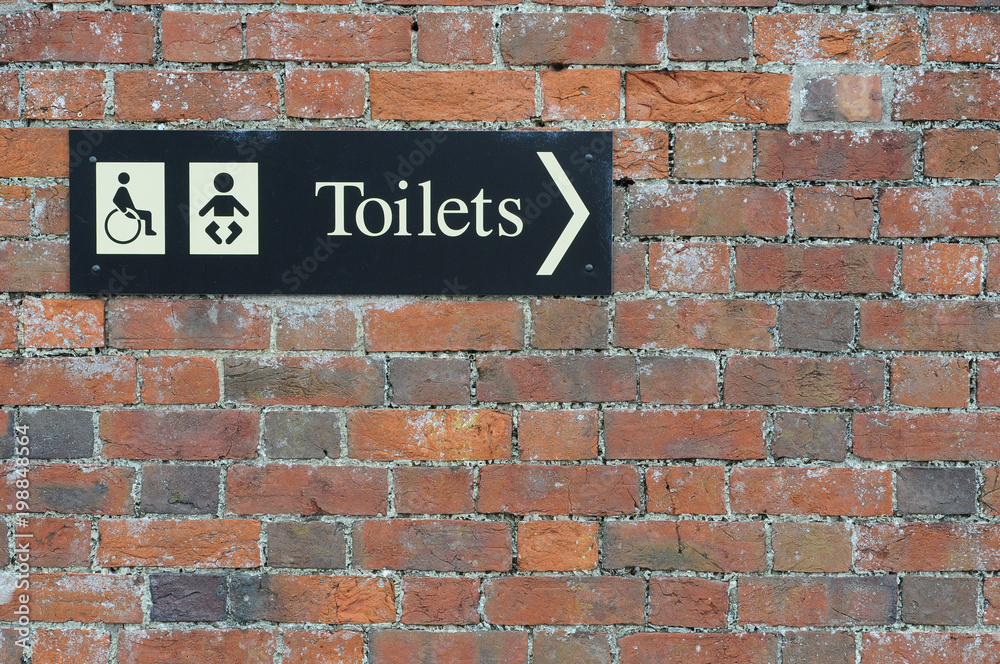 disabled Toilet and baby changing sign on wall disabled Toilet and baby changing sign on wall
