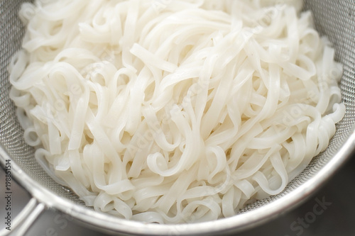 Boiled rice noodles in sieve