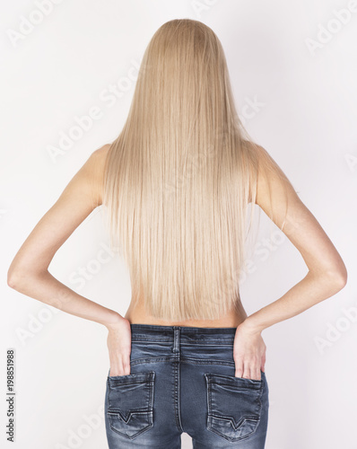Healthy straight platinum blonde hair. Look from the back.