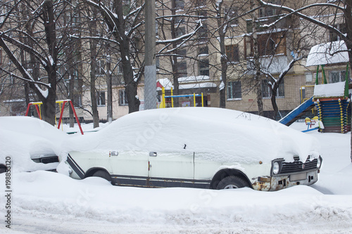 Parked car under snow