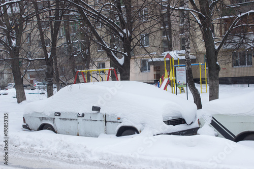 Parked car under snow