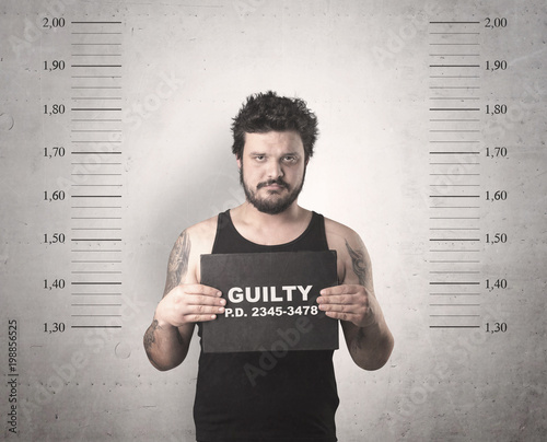 Caught guilty man with ID signs on his hand.