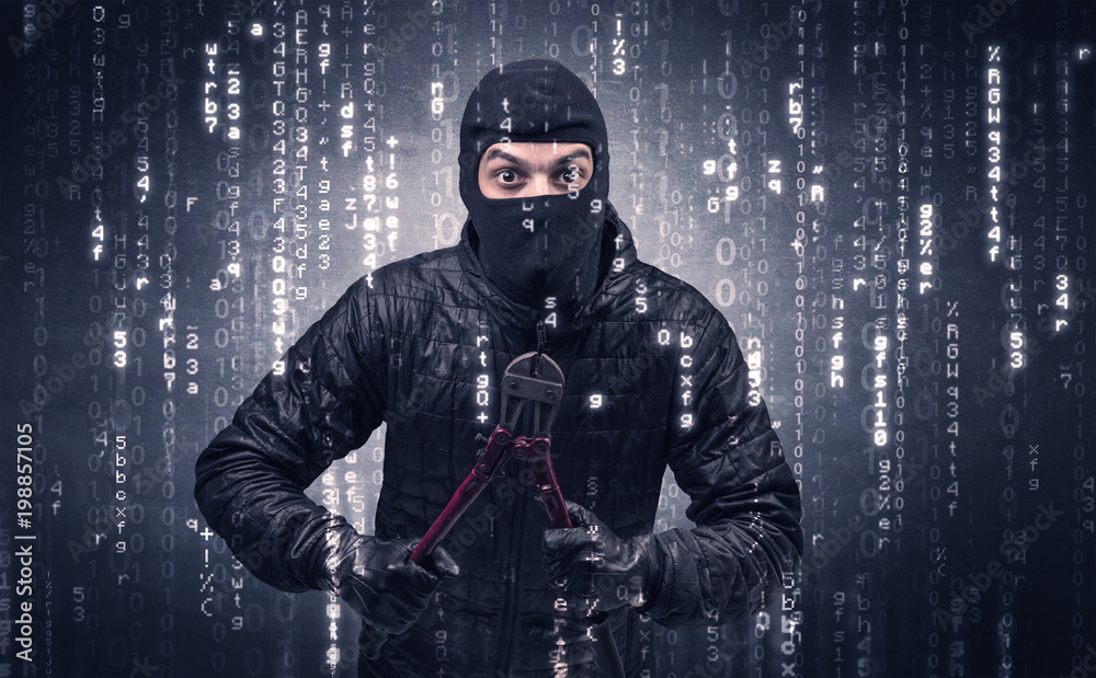 Burglar in action with encoded concept and his tools in his hand. Burglar in action with encoded concept and his tools in his hand.