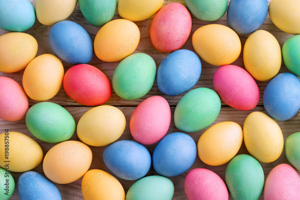 Easter background with Easter eggs and spring flowers. Top view with copy space. Easter background with Easter eggs and spring flowers. Top view with copy space.