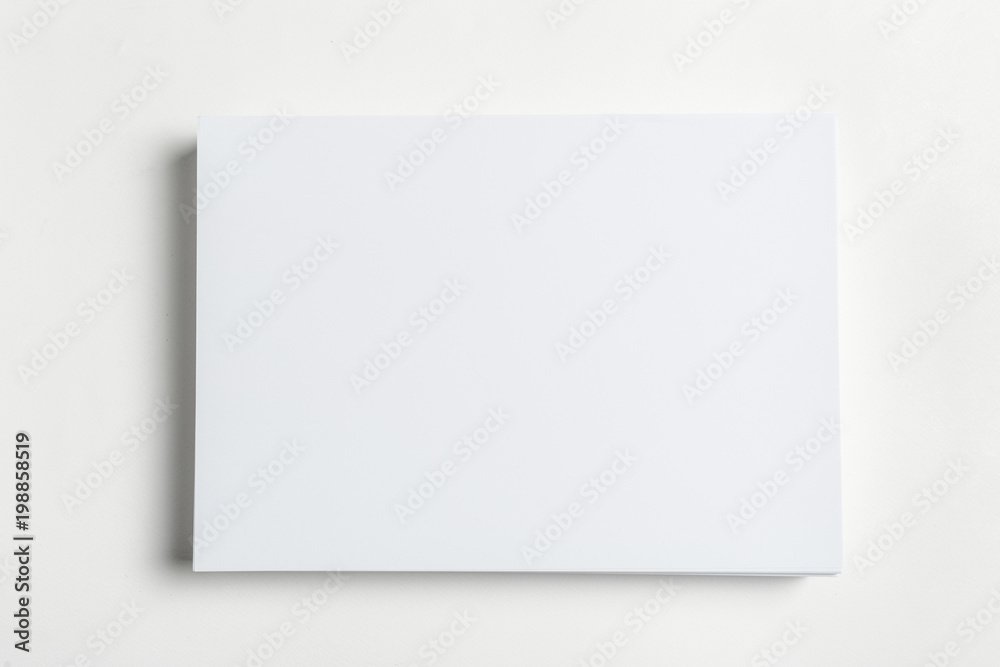 White business card on wooden table. Blank portrait A4. White business card on wooden table. Blank portrait A4.