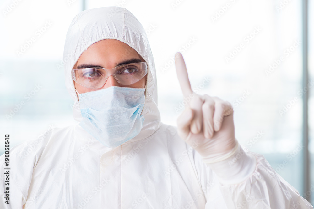 Young chemist pressing virtual buttons in lab Young chemist pressing virtual buttons in lab