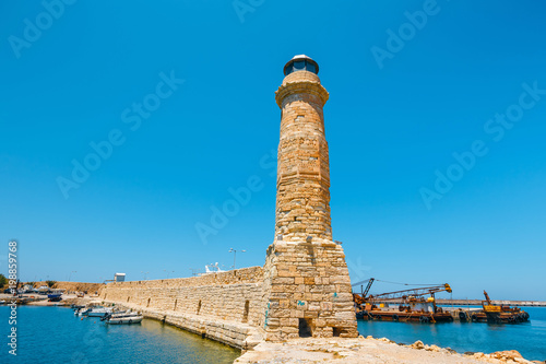 Lighthouse in old harbor in Rethymno, Crete, Greece